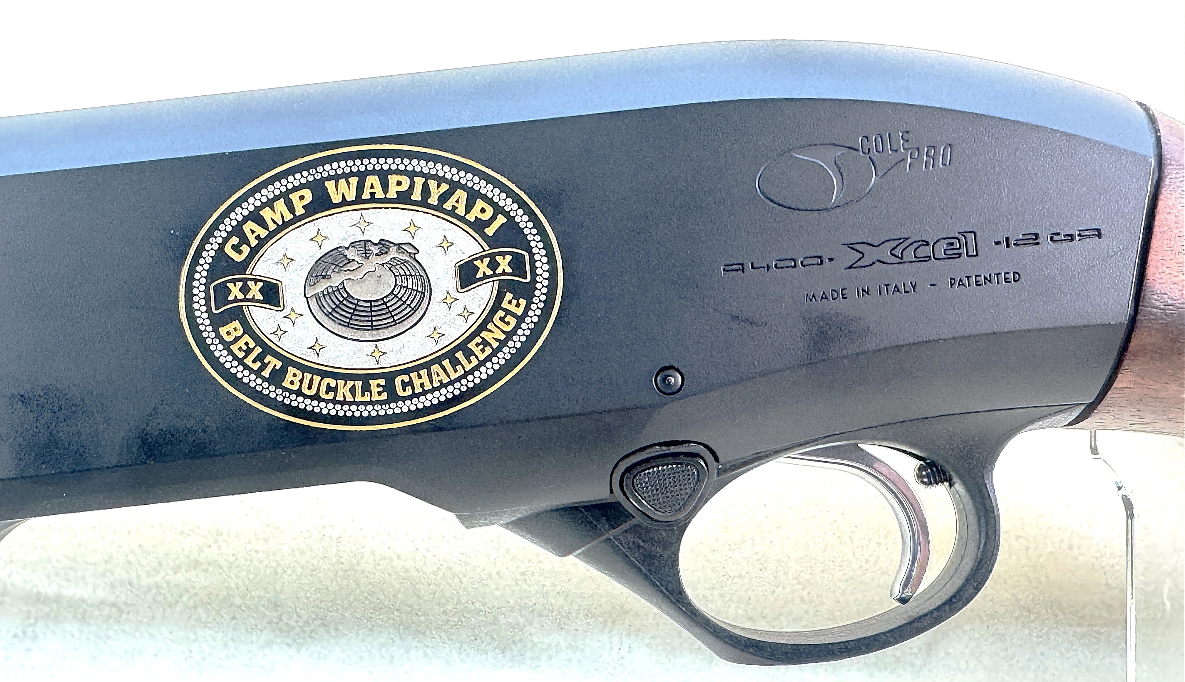 Camp Wapiyapi Belt Buckle Challenge engraving on the A400 receiver