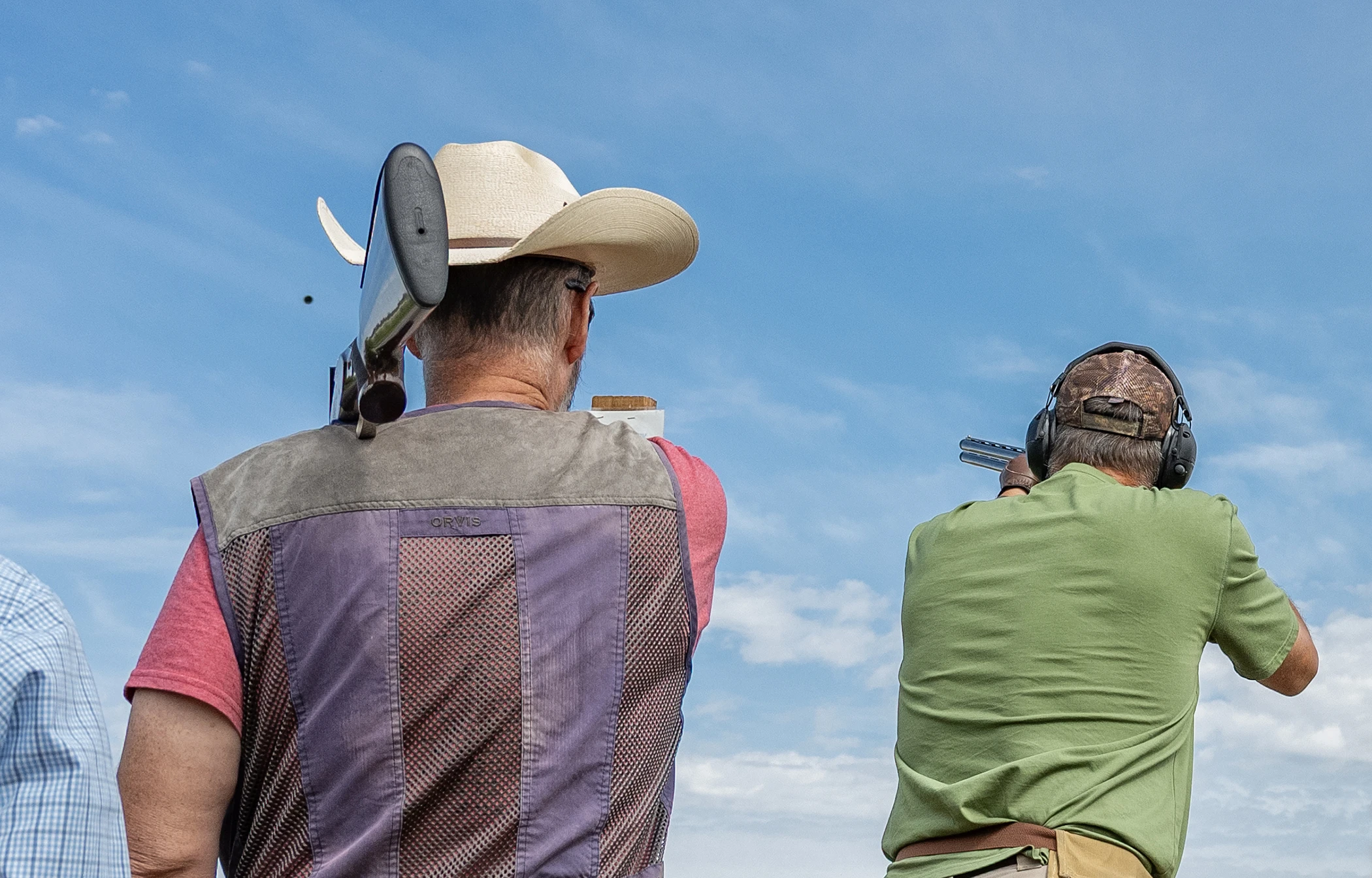 Shooters at a sporting clays station